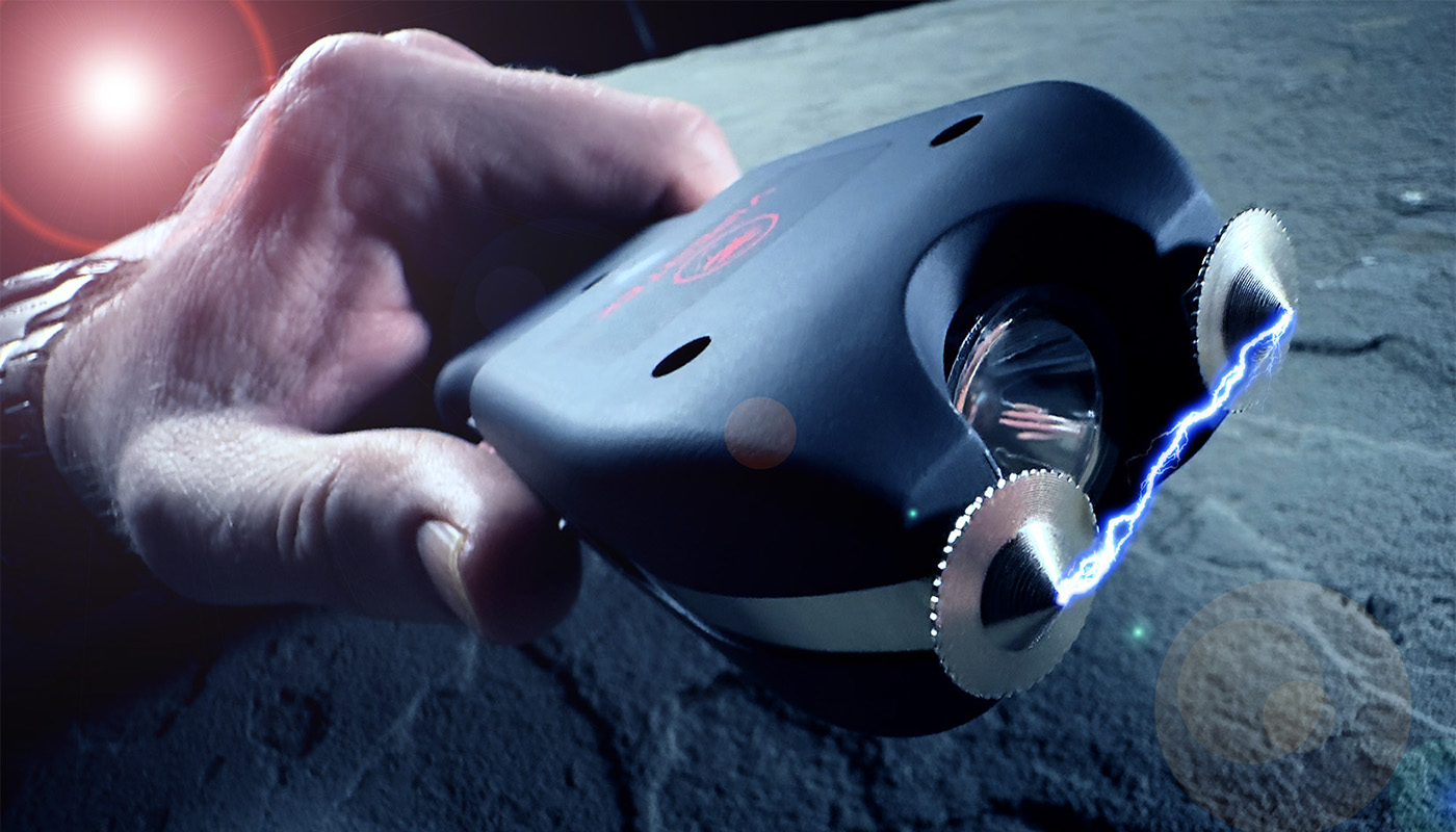 Activated stun gun showing electric arc between electrodes